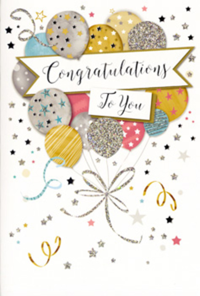 In this image, an ornate congratulations card stands upright against a simple backdrop, its design full of the quiet excitement that often follows good news in Plaistow households. The focal point is a joyful cluster of balloons positioned near the top and middle of the card, their rounded shapes overlapping in a natural, almost three-dimensional way. The colours are soft yet celebratory: brushed gold, satin silver, champagne, pastel pink, airy sky blue, and gentle grey, each balloon subtly shaded to suggest depth. Fine details bring each one to life-some are scattered with petite star motifs, others wear slender stripes or a mist of shimmering specks, all created with metallic ink that seems to catch an invisible light, much like evening sunshine glinting off windows along Plaistow Road. From this central balloon bouquet, an array of thin metallic ribbons cascades downward, drawn in graceful curls of gold and silver that cross and loop with the casual tangle of real balloon strings. Around them, tiny stars, swirls, and confetti-like dots drift across the soft background, giving the sense of movement, as though the card itself were part of a celebration in full swing. Cutting across the design is a broad, gently arched banner that settles comfortably in the centre of the card. On this banner, the words Congratulations To You are written in flowing, decorative script, the style elegant yet approachable, reminiscent of a handwritten note chosen with care. The composition feels balanced and timeless, making this card a fitting companion to a bouquet delivered for graduations, promotions, or any important achievement being celebrated in and around Plaistow.