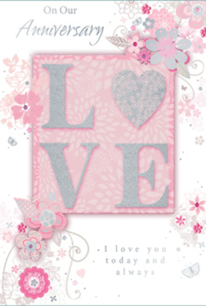 This anniversary card feels like a hand-tied arrangement laid out on a pale tablecloth in a Plaistow kitchen, bathed in gentle daylight. At the centre, the word LOVE rises in prominent, raised letters, lavishly yet delicately dusted with fine glitter that catches light in blush pink, pearl white, and silver tones. The embossed texture invites fingertips to trace each letter, giving a tactile sense of importance to the word itself. Behind and around it, the background shifts into a soft, powdery pink, creating a warm, romantic field for the design. From the edges, wisps of stylised flowers and leafy sprays curl inward, their lines thin and graceful, reminiscent of the loose, flowing sketches a florist might make when designing an anniversary bouquet for delivery across Plaistow. These illustrated blooms, in shades of blush, soft grey, and metallic silver, seem to float rather than sit flat, thanks to gentle shading and layered details. The vines sweep in looping arcs, adding a sense of rhythm and calm, like the quiet pace of nearby residential streets in the early evening. Intertwined with the floral motif, elegant script text offers loving anniversary sentiments in a refined, calligraphic style, balancing the bolder central lettering. The entire composition is lit softly, giving the image a diffused glow that enhances its tender mood. This card feels like a lasting token of devotion - a paper echo of the soft, romantic arrangements often chosen to mark special anniversaries, capturing the atmosphere of Plaistow's quiet, heartfelt celebrations.