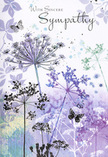 This sympathy card feels like a soft, visual whisper carried through the quieter streets of Plaistow. Across the front, a meadow of airy wildflowers unfolds in silhouette, their tall, slender stems drawn with almost calligraphic lines that lead up to intricate, umbel-shaped flower heads. These blooms are bathing in a palette of cool, comforting tones: lavender, indigo, and soft blue intermingle with touches of silvery green, suggesting twilight light resting over a secluded garden off Balaam Street. The edges of each flower head seem to evaporate into the background, giving the design an almost dreamlike motion, as if the plants sway in a wind you cannot quite feel. Pale, translucent butterflies hover among the stems, their wings barely more than a wash of lilac and blue, evoking transformation, gentle presence, and the sense that loved ones remain close in spirit. Behind this delicate scene, the background is a haze of watercolour, layered in misty purples and soft greys that blur together without hard borders, like distant lights softened through a rainy window. The phrase With Sincere Sympathy rests above or beside the flowers in an elegant, flowing script, its curves mirroring the natural grace of the stems. Every detail-colour, spacing, and line-has been chosen to soothe rather than startle. For those in Plaistow seeking a respectful way to share their condolences, this card offers a quiet visual embrace, especially when paired with a thoughtfully arranged sympathy bouquet delivered to a local home, chapel, or funeral gathering.